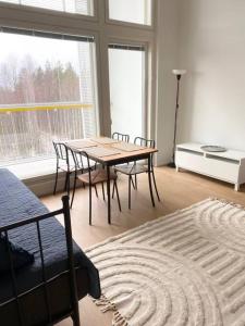 a dining room with a table and chairs in a room at TUUSULA Tuusula 15 min drive to Airport in Tuusula