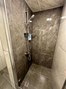 a shower with a glass door in a bathroom at Ale Boutique Apartments in Antalya