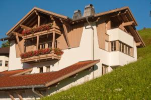 a building with flower boxes on the side of it at Appartement Montanea in Schruns-Tschagguns