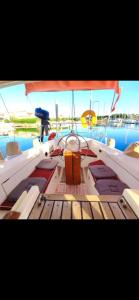 a boat sitting in the middle of the water at chez will in Cap d'Agde