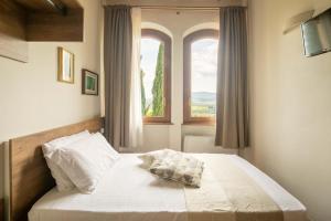 Podere La Quercia客房内的一张或多张床位