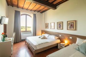Podere La Quercia客房内的一张或多张床位