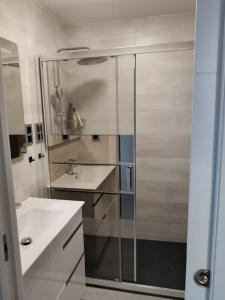 a bathroom with a shower and a sink at CHARMING APARTMENT IN CALDETES in Caldes d'Estrac
