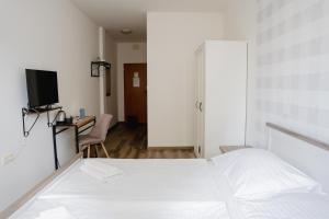 Posteľ alebo postele v izbe v ubytovaní Hotel Arko
