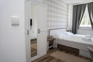 Posteľ alebo postele v izbe v ubytovaní Hotel Arko
