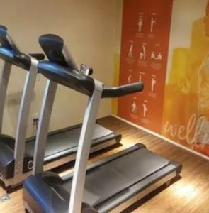 a gym with a treadmill in a room at Intercity Interative São Paulo Jardins in Sao Paulo