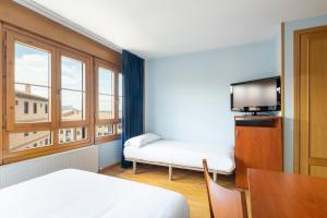 Postel nebo postele na pokoji v ubytování Hostal Alda Río Duero + 18 fotografií