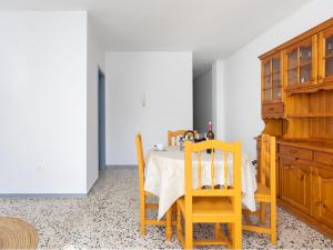 a dining room with a table and two chairs at Live Puertito Rifrajo in Puertito de Güímar +27 photos