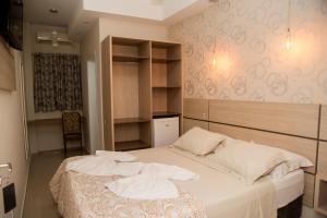 Krevet ili kreveti u jedinici u okviru objekta HN-Hotel Natal Penha