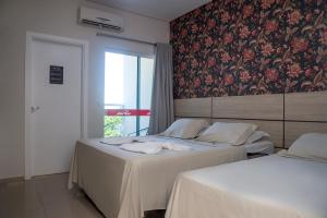 Krevet ili kreveti u jedinici u okviru objekta HN-Hotel Natal Penha
