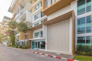 a facade of a building on a street at 2 Bedroom Apartment only 10 min from Patong beach in Kathu
