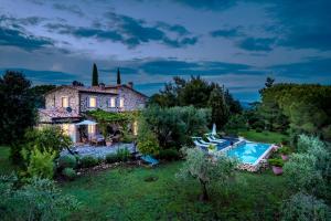 an external view of a house with a swimming pool at PODERE SAN GIORGIO 6, Emma Villas in Manciano