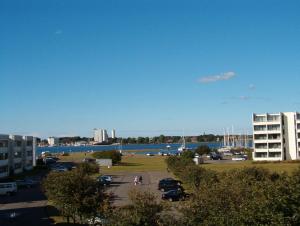 a view of a parking lot next to a marina at Ferienwohnung Meernähe in Fehmarn