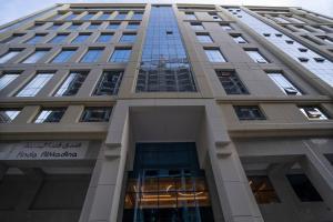 a view of the trump international hotel tower from the street at Finda Hotel in Medina