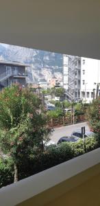 a window with a view of a parking lot at Easy Gardalake in Riva del Garda