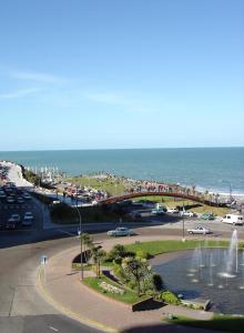 a bridge over a road next to the ocean at Hotel Guerrero in Mar del Plata