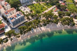 an aerial view of a city with a large body of water at Hotel Central Beach 9 in Makarska