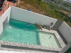 an overhead view of a swimming pool on a building at Portobelo in San Juan