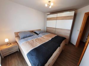 Postel nebo postele na pokoji v ubytování Ferienhaus Emelie Geiseltalsee