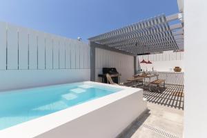 a swimming pool on the roof of a house at Casa Alegra in Carvalhal