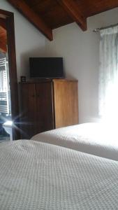 Postel nebo postele na pokoji v ubytování Hostal El Recanto