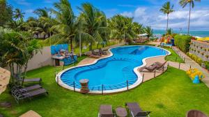 an image of a swimming pool at a resort at Pousada Polymar in Maragogi