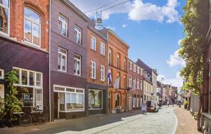 a city street with many buildings on a street at Chambers Roermond in Roermond