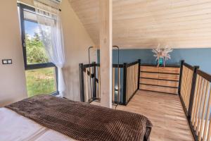 Postel nebo postele na pokoji v ubytování Kaszubska Lawenda Żuromino, Domek nr 1