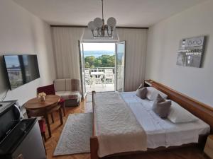 Postel nebo postele na pokoji v ubytování Apartments Žara