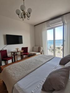 Postel nebo postele na pokoji v ubytování Apartments Žara