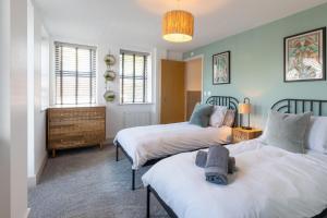 מיטה או מיטות בחדר ב-Oxford Heights