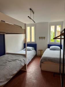 Postel nebo postele na pokoji v ubytování Maison Emile - Coeur du village - 8 personnes - Clim - Superbe literie