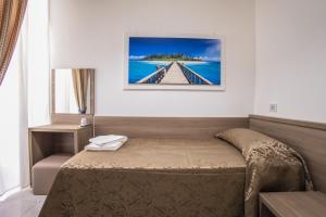 Postel nebo postele na pokoji v ubytování Hotel Orbis