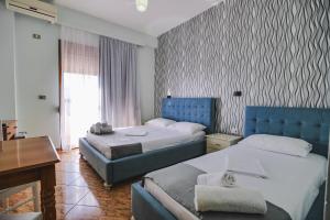 Postel nebo postele na pokoji v ubytování Hotel Panorama