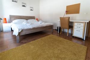 Cama o camas de una habitación en Los Lorentes Residences Bulle