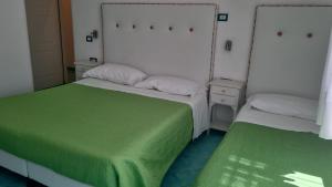 Cama o camas de una habitación en Albergo S. Andrea