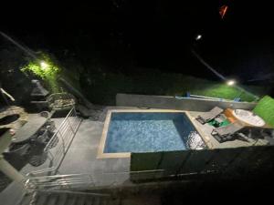 The swimming pool at or close to WHİTE ROSE VİLLA Jakuzili ve Isıtma Havuzlu