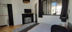 En eller flere senge i et værelse på Le Brooklyn Superbe appartement proximité vieille ville