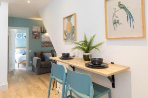 a dining room with a table and chairs at The Old Stables in Southampton