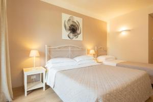 Postel nebo postele na pokoji v ubytování Hotel Giardino Suites&Spa