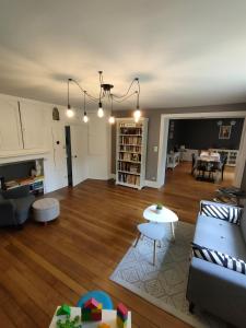 a living room with a couch and a table at Chambres d'h&ocirc;tes La Tuilerie in Blainville-sur-lʼEau