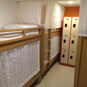 Postel nebo postele na pokoji v ubytování Stone House Hotel Pasay