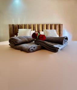 a pile of pillows sitting on top of a bed at Golden house in Marrakesh