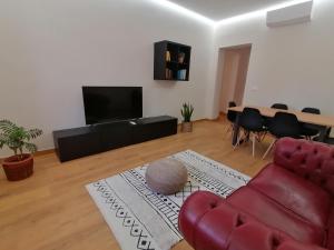 TV a/nebo společenská místnost v ubytování Appartamento I Mori