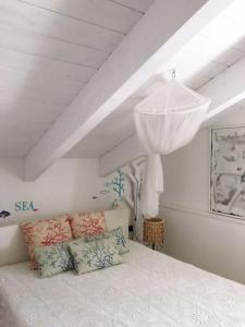Ліжко або ліжка в номері COCOSEA: Un attico con vista mozzafiato