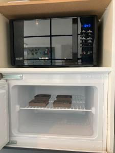 a microwave oven with some food inside of it at Seaview Penthouse Oostende in Ostend