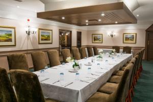 a conference room with a long table and chairs at The Waterside in Peterhead