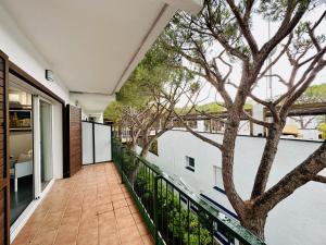 a balcony of a house with a tree at Paradis CostaBravaSi in Platja d'Aro