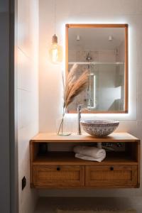 a bathroom with a sink and a mirror at Kurka Chata in Nowy Targ