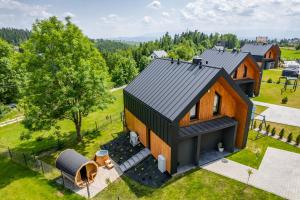 an overhead view of a home with a black roof at Kurka Chata in Nowy Targ
